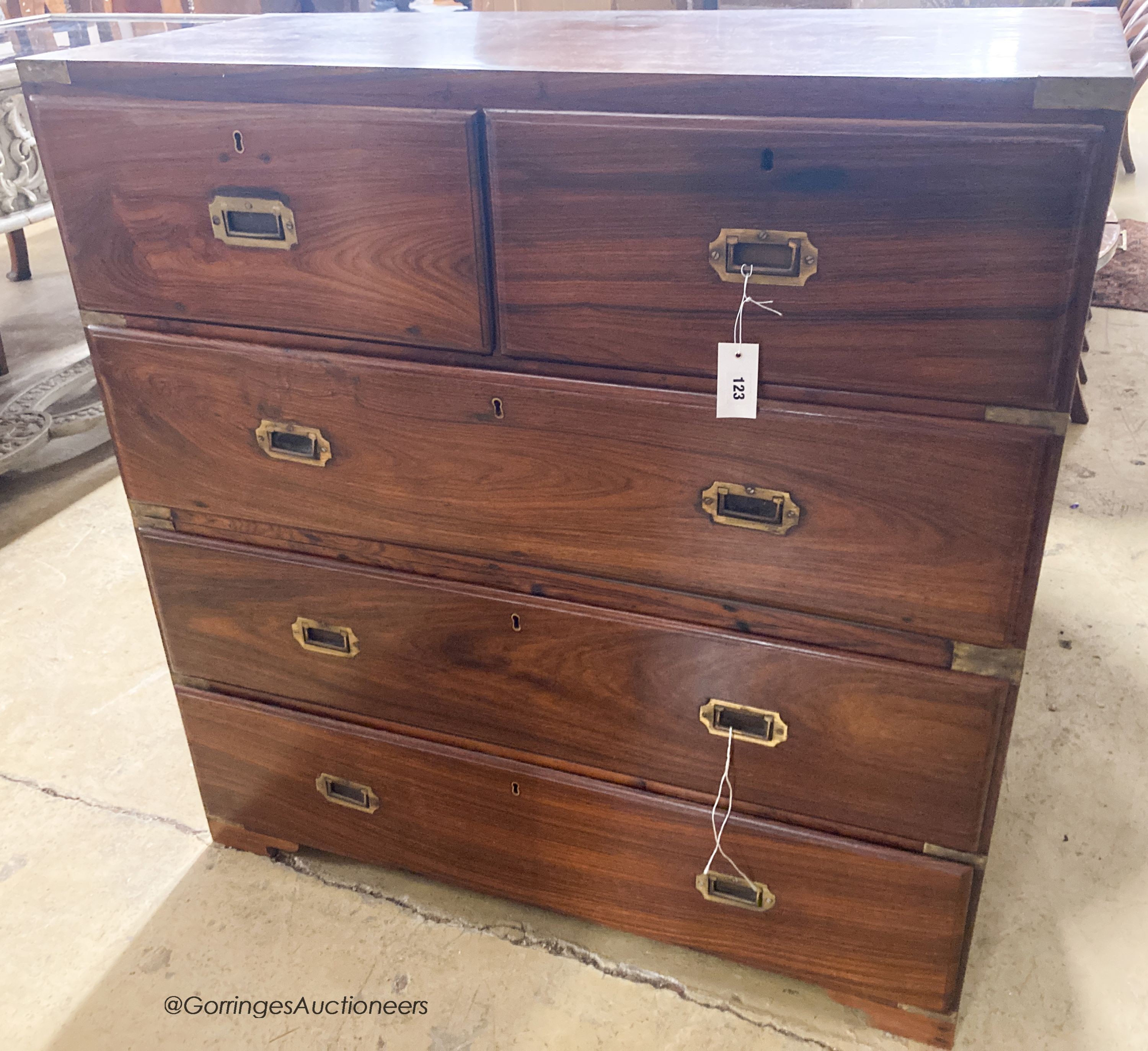 An early 20th century Anglo Indian rosewood two part military chest with brass inset handles, width 103cm, depth 44cm, height 107cm